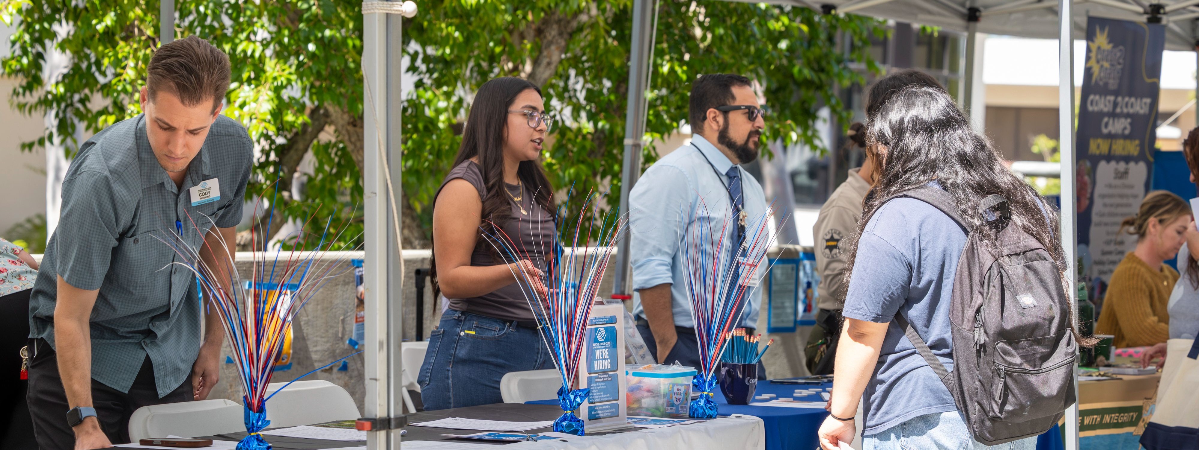 A student talking to an employer at the 2026 Career Fair